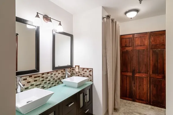 a bathroom with a sink and a mirror