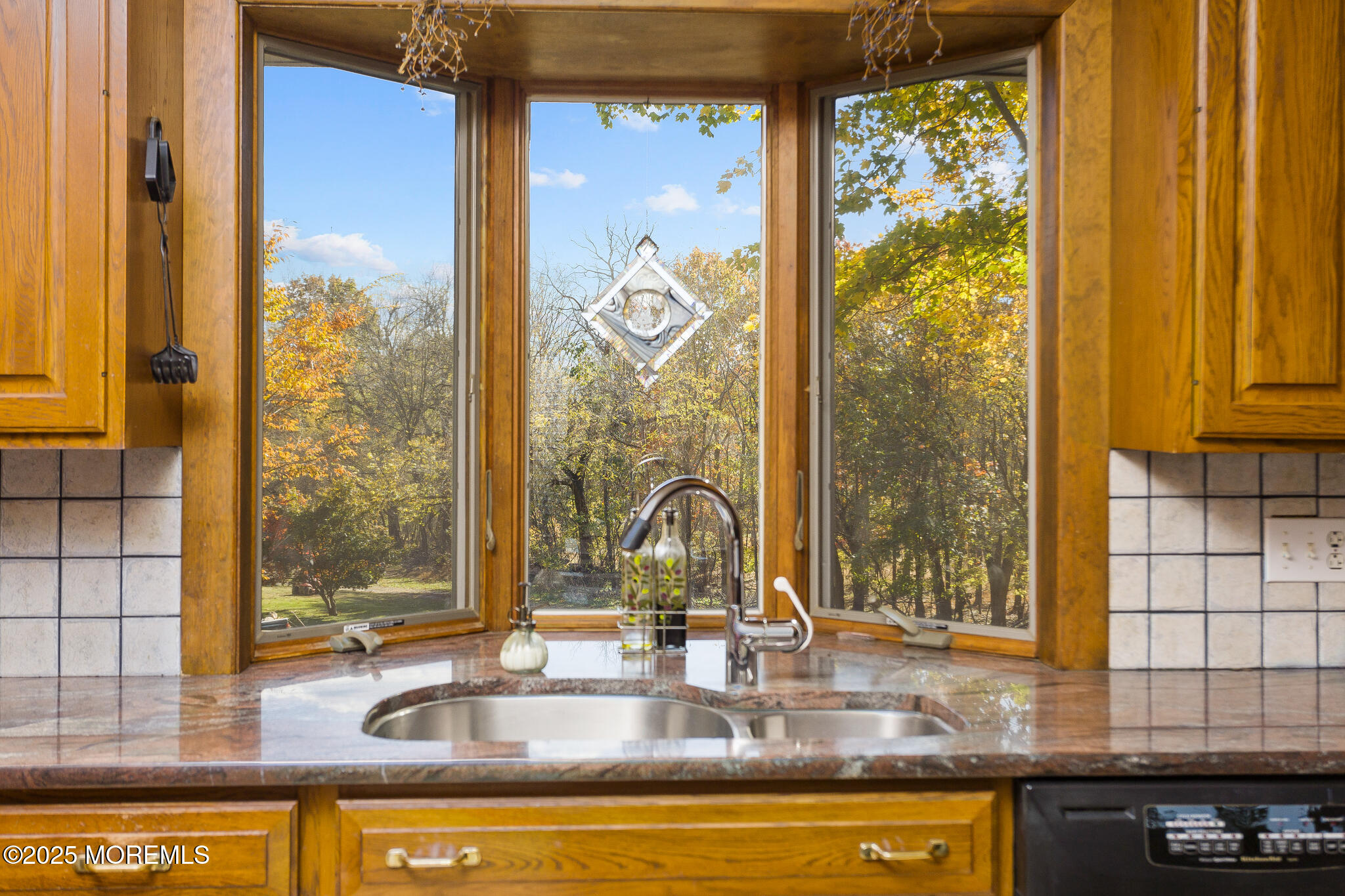 193 Burlington Path Road Cream Ridge, NJ 08514 - Photo 16 of 51 a bathroom with a granite countertop sink and a large mirror next to a window