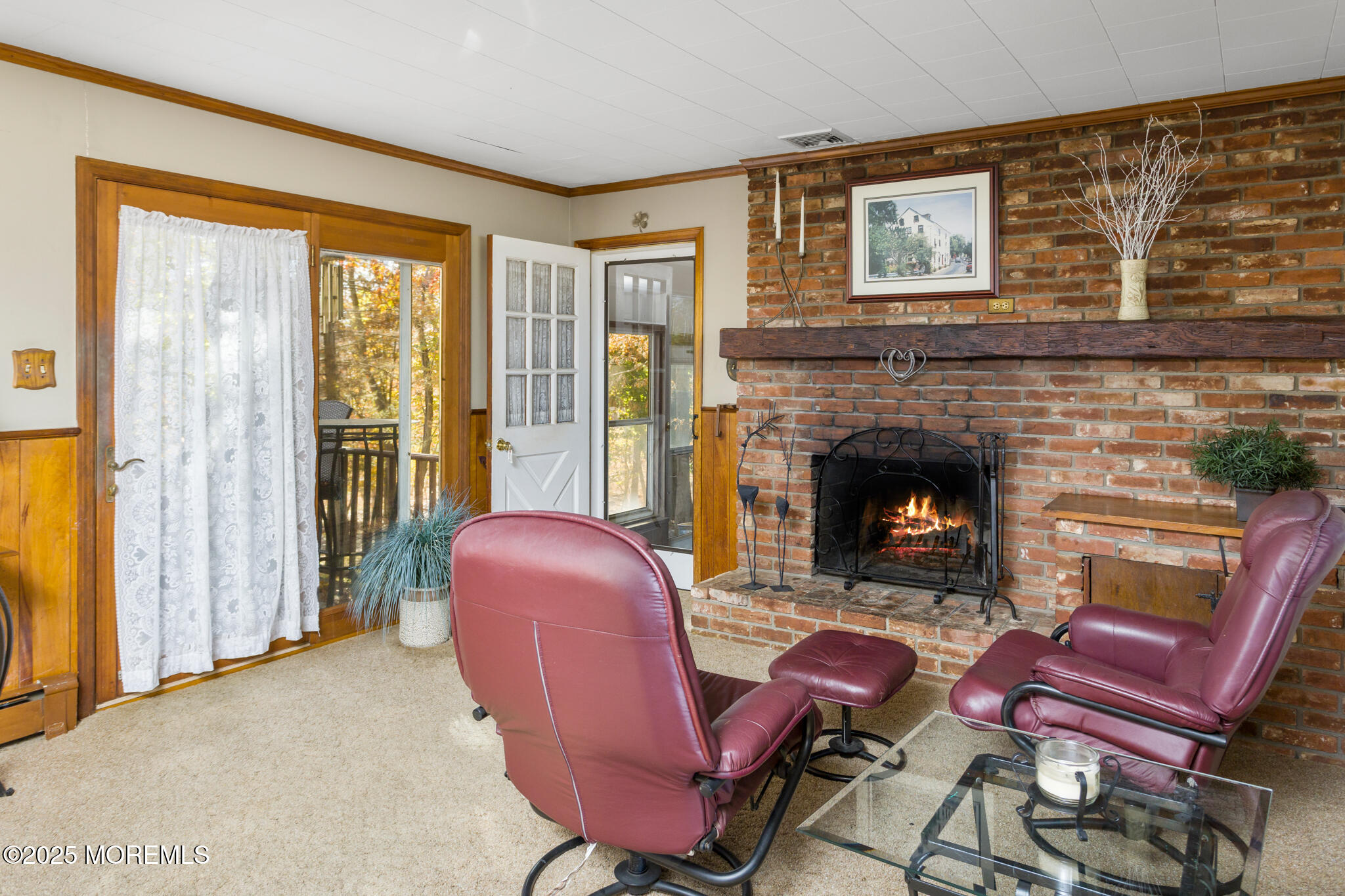 193 Burlington Path Road Cream Ridge, NJ 08514 - Photo 19 of 51 a living room with furniture a flat screen tv and a fireplace