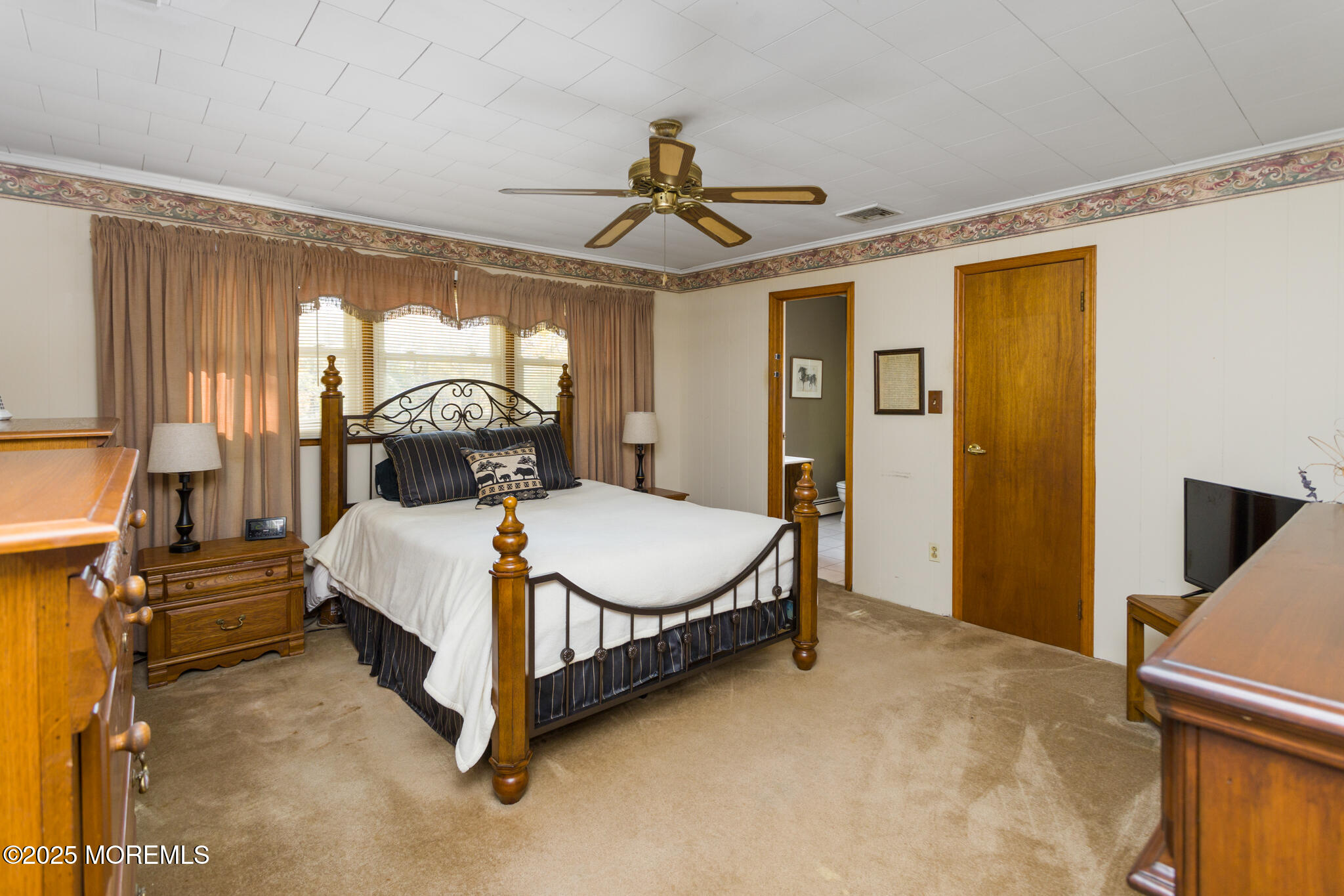 193 Burlington Path Road Cream Ridge, NJ 08514 - Photo 21 of 51 a bedroom with a bed mirror and window