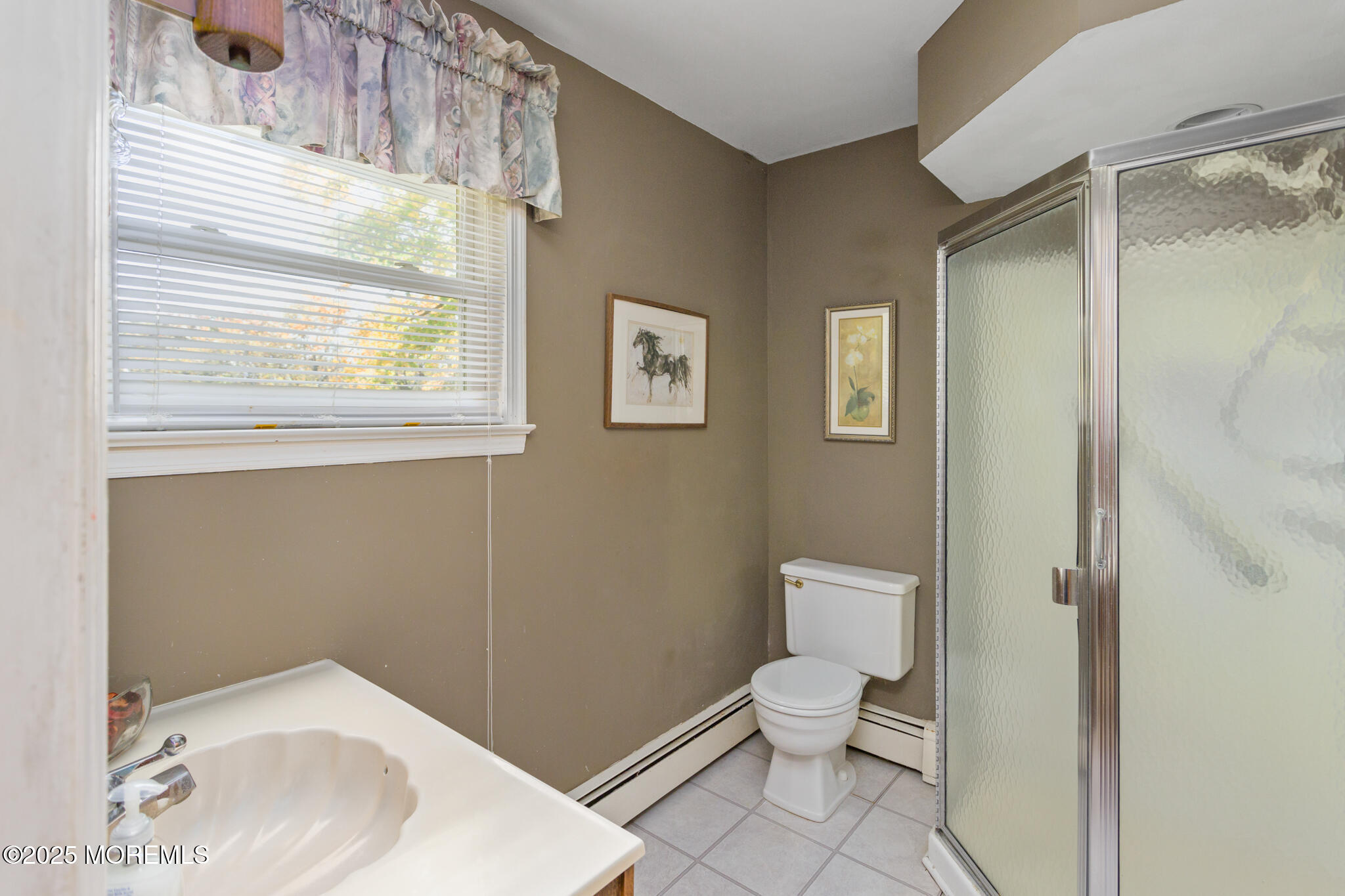 193 Burlington Path Road Cream Ridge, NJ 08514 - Photo 23 of 51 a bathroom with a toilet a sink and a window