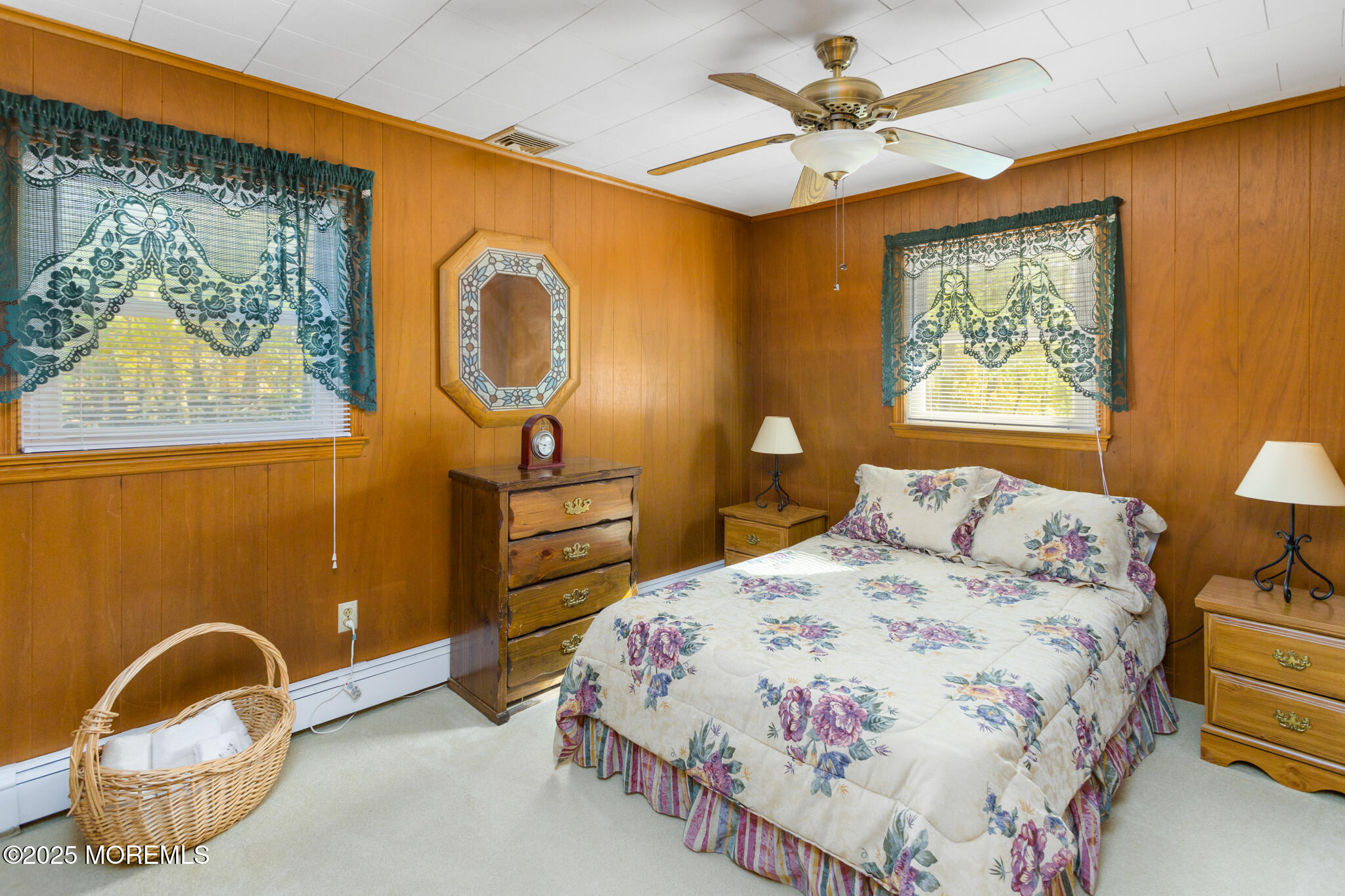 193 Burlington Path Road Cream Ridge, NJ 08514 - Photo 24 of 51 a bedroom with a bed and a painting on the wall
