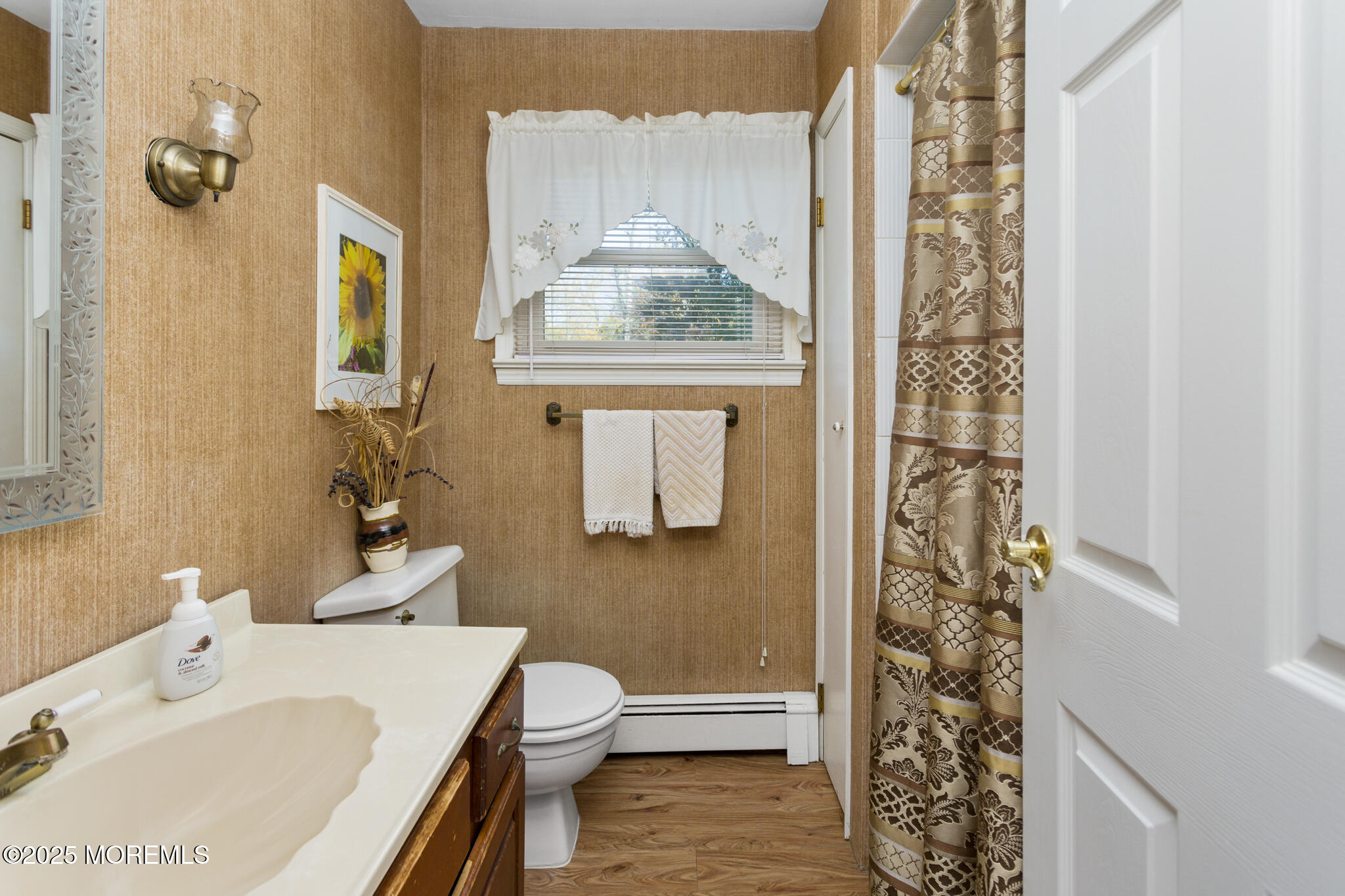 193 Burlington Path Road Cream Ridge, NJ 08514 - Photo 25 of 51 a bathroom with a sink a toilet and shower curtain