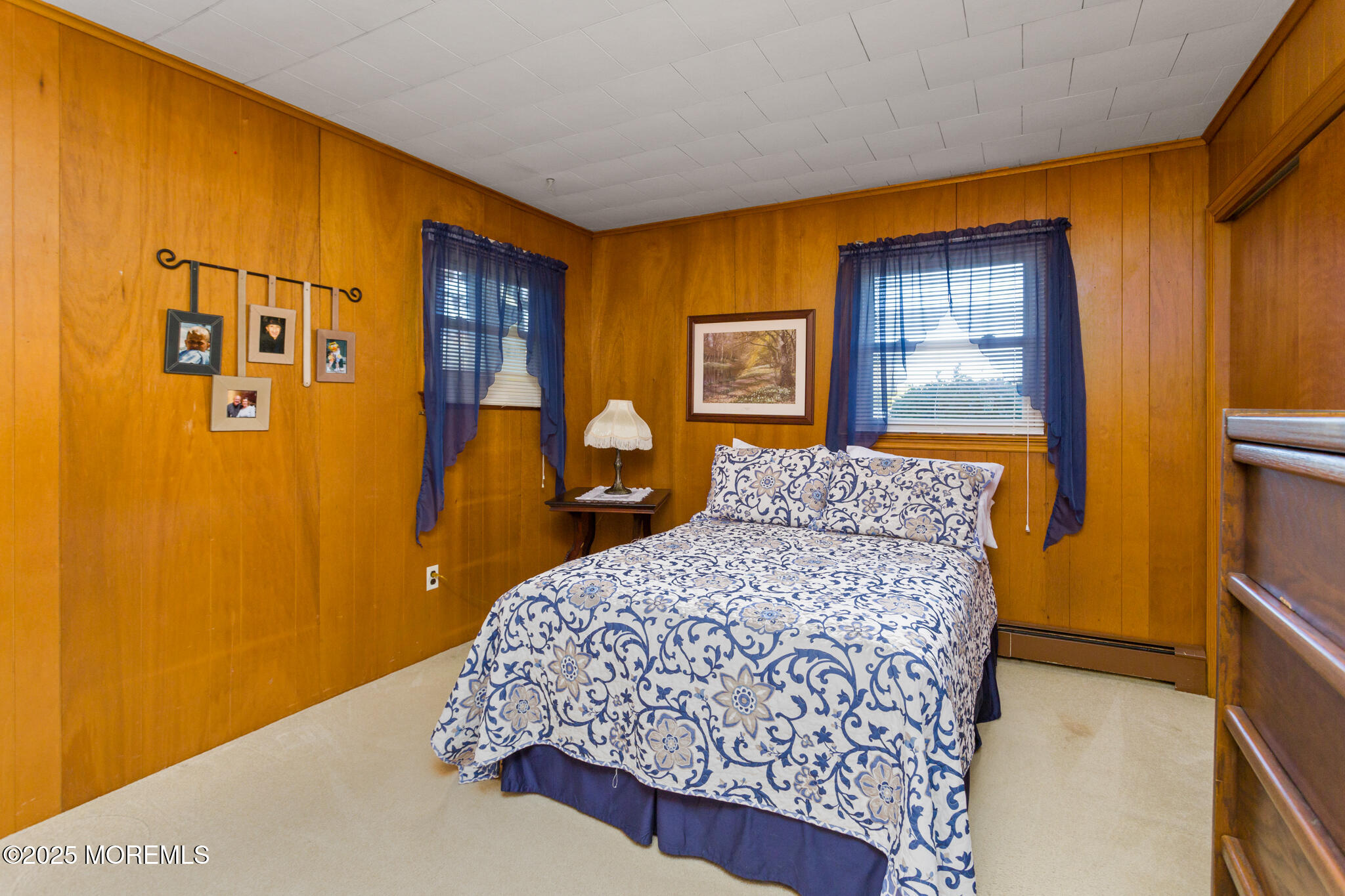 193 Burlington Path Road Cream Ridge, NJ 08514 - Photo 28 of 51 a bedroom with a bed and wooden floor