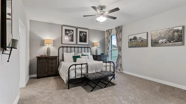 a living room with furniture fireplace and a large window