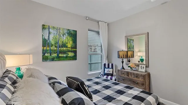 a living room with furniture a rug and a window