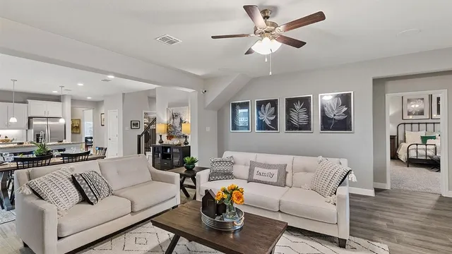 a large kitchen with a table and chairs
