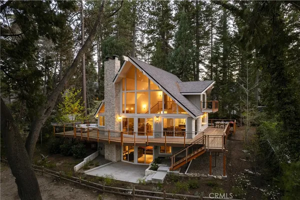 a view of house with outdoor space and sitting area