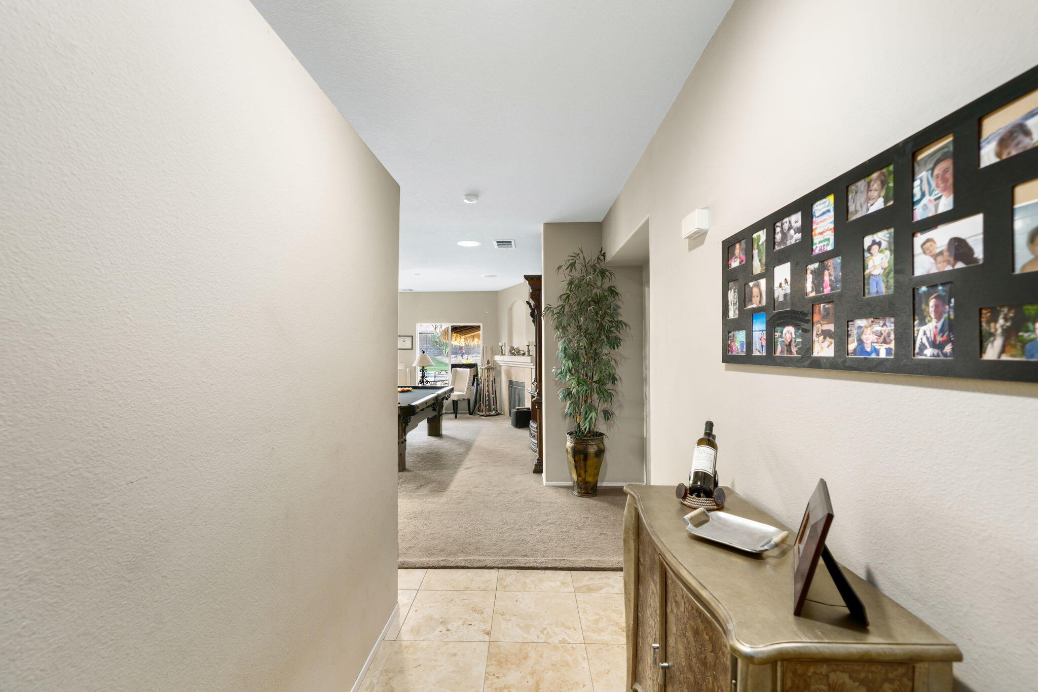 83258 Brighton Crest Drive Indio, CA 92203 - Photo 15 of 69 a living room with furniture and a book shelf