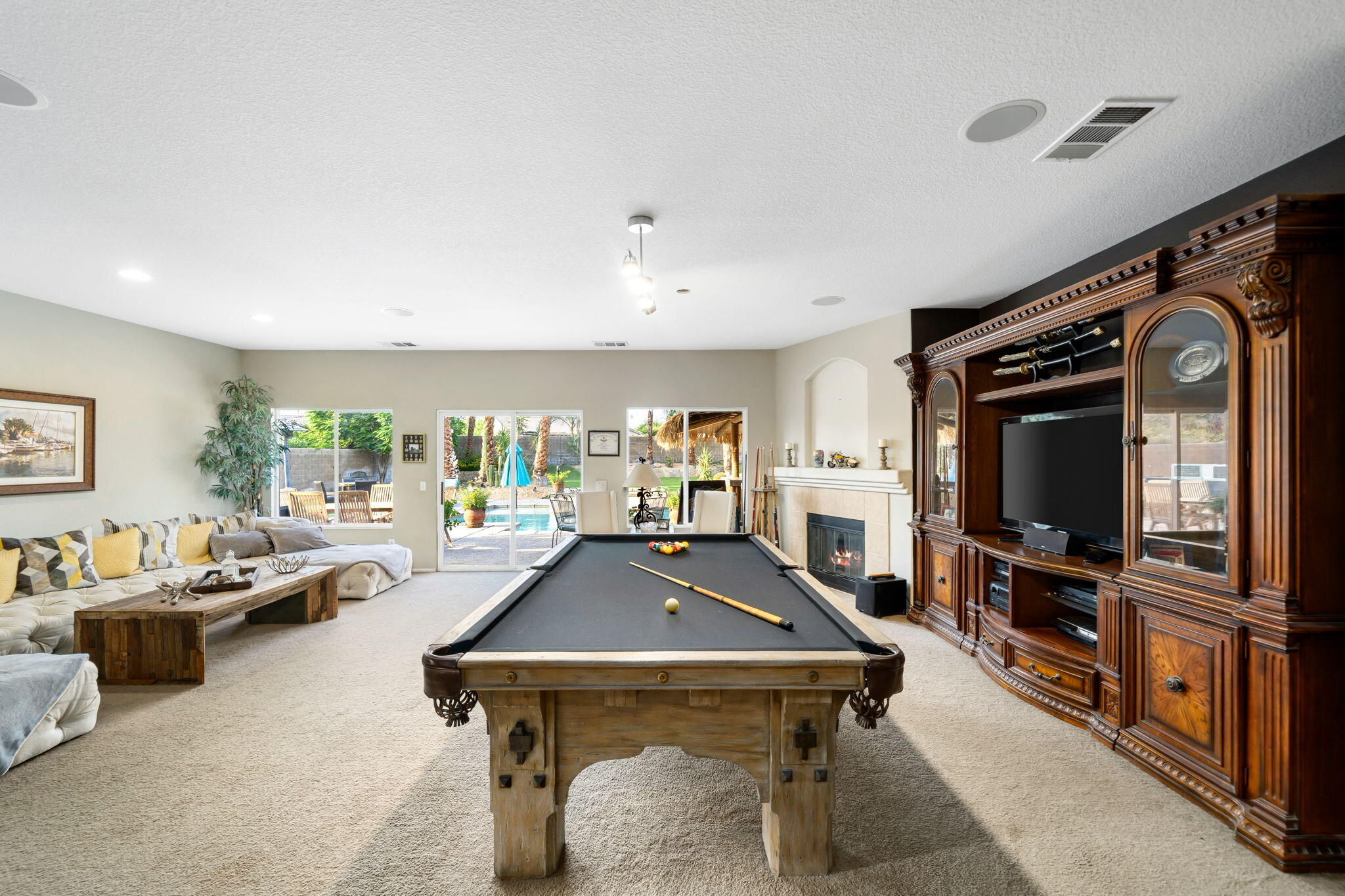 83258 Brighton Crest Drive Indio, CA 92203 - Photo 17 of 69 a living room with furniture and a flat screen tv