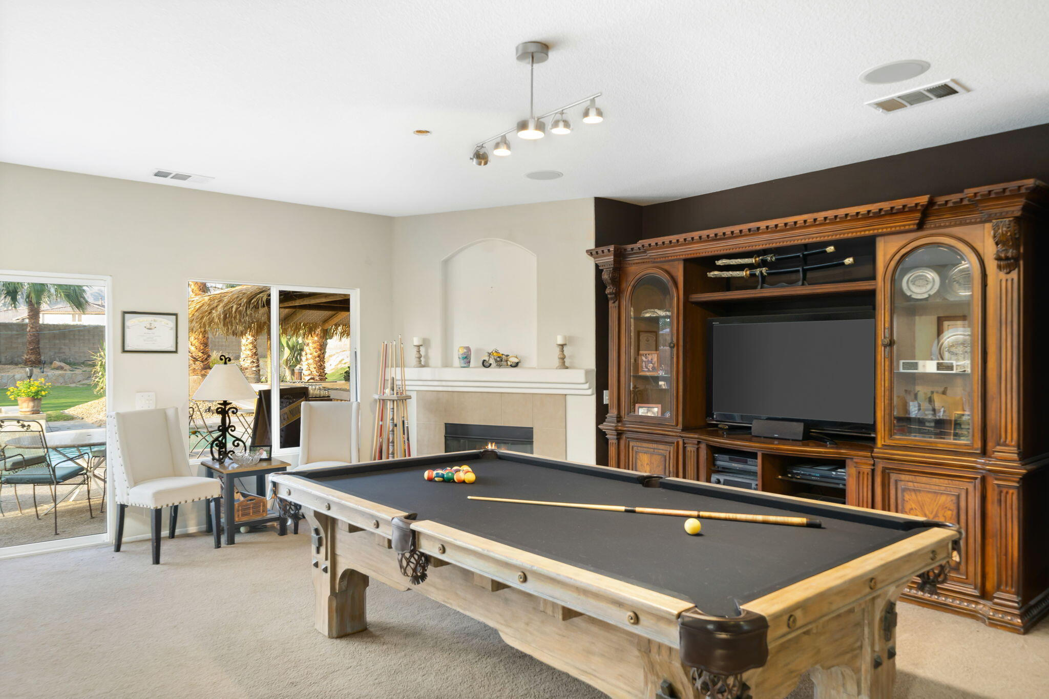 83258 Brighton Crest Drive Indio, CA 92203 - Photo 18 of 69 a living room with stainless steel appliances furniture and flat screen tv