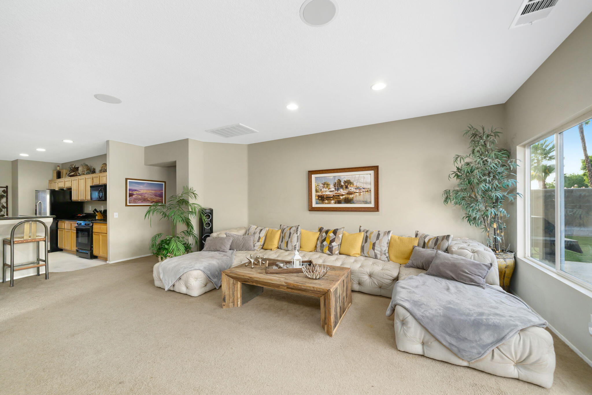 83258 Brighton Crest Drive Indio, CA 92203 - Photo 20 of 69 a living room with furniture and a potted plant