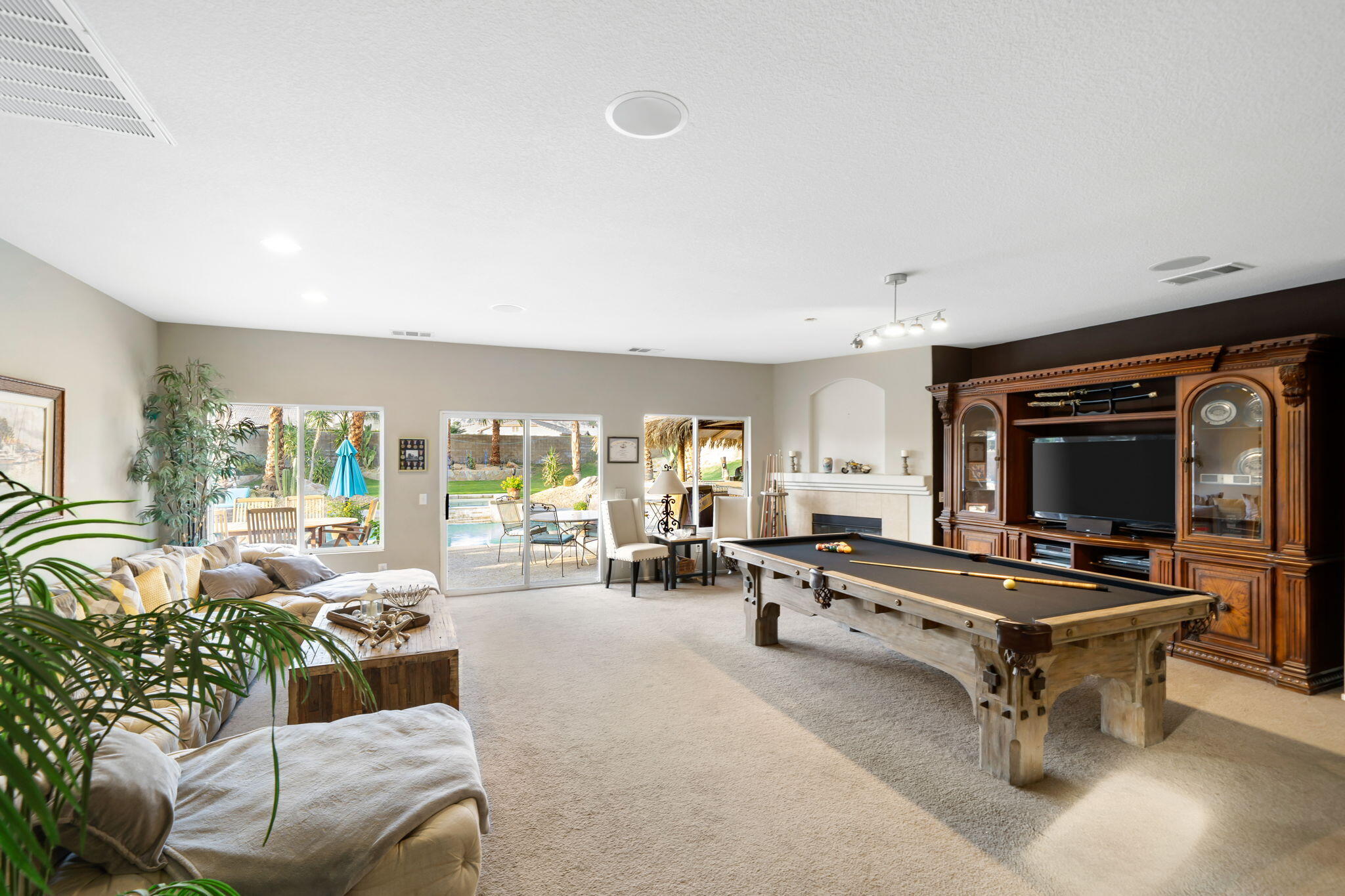 83258 Brighton Crest Drive Indio, CA 92203 - Photo 22 of 69 a living room with furniture and a flat screen tv