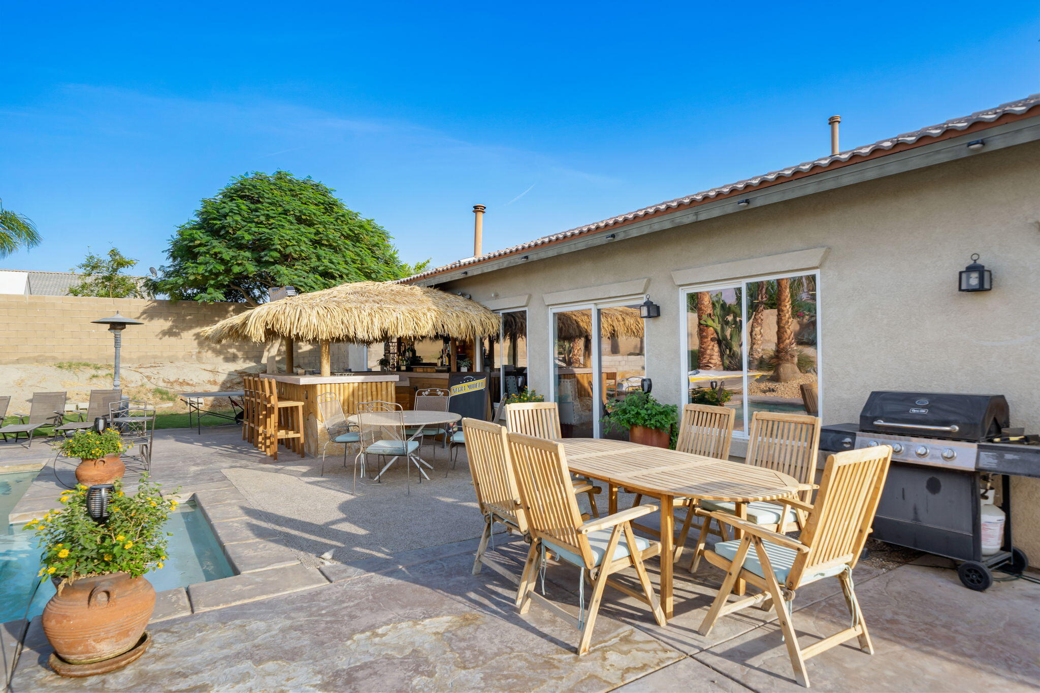 83258 Brighton Crest Drive Indio, CA 92203 - Photo 26 of 69 a view of a patio with table and chairs under an umbrella