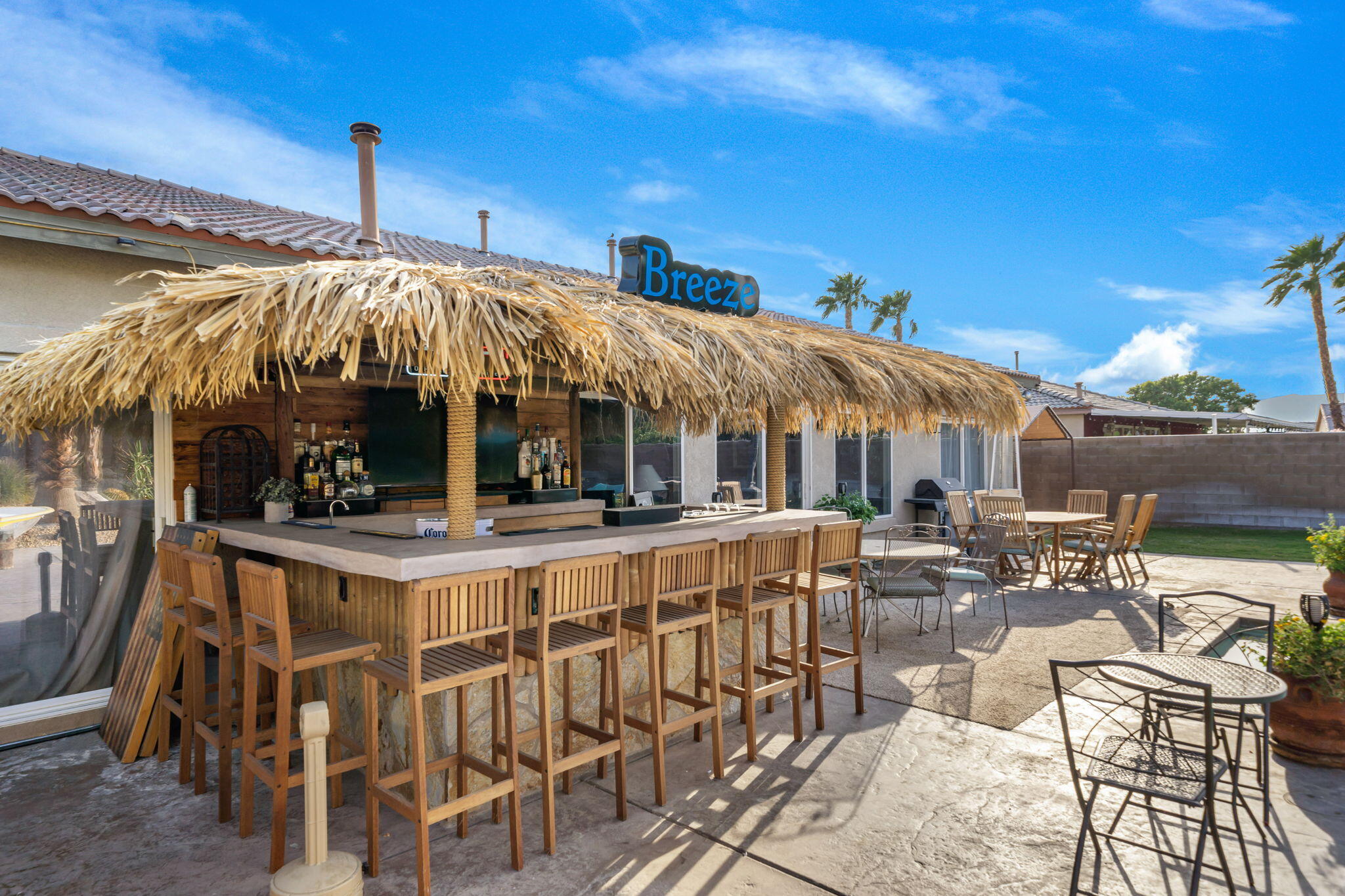 83258 Brighton Crest Drive Indio, CA 92203 - Photo 27 of 69 a view of a patio with table and chairs with wooden floor