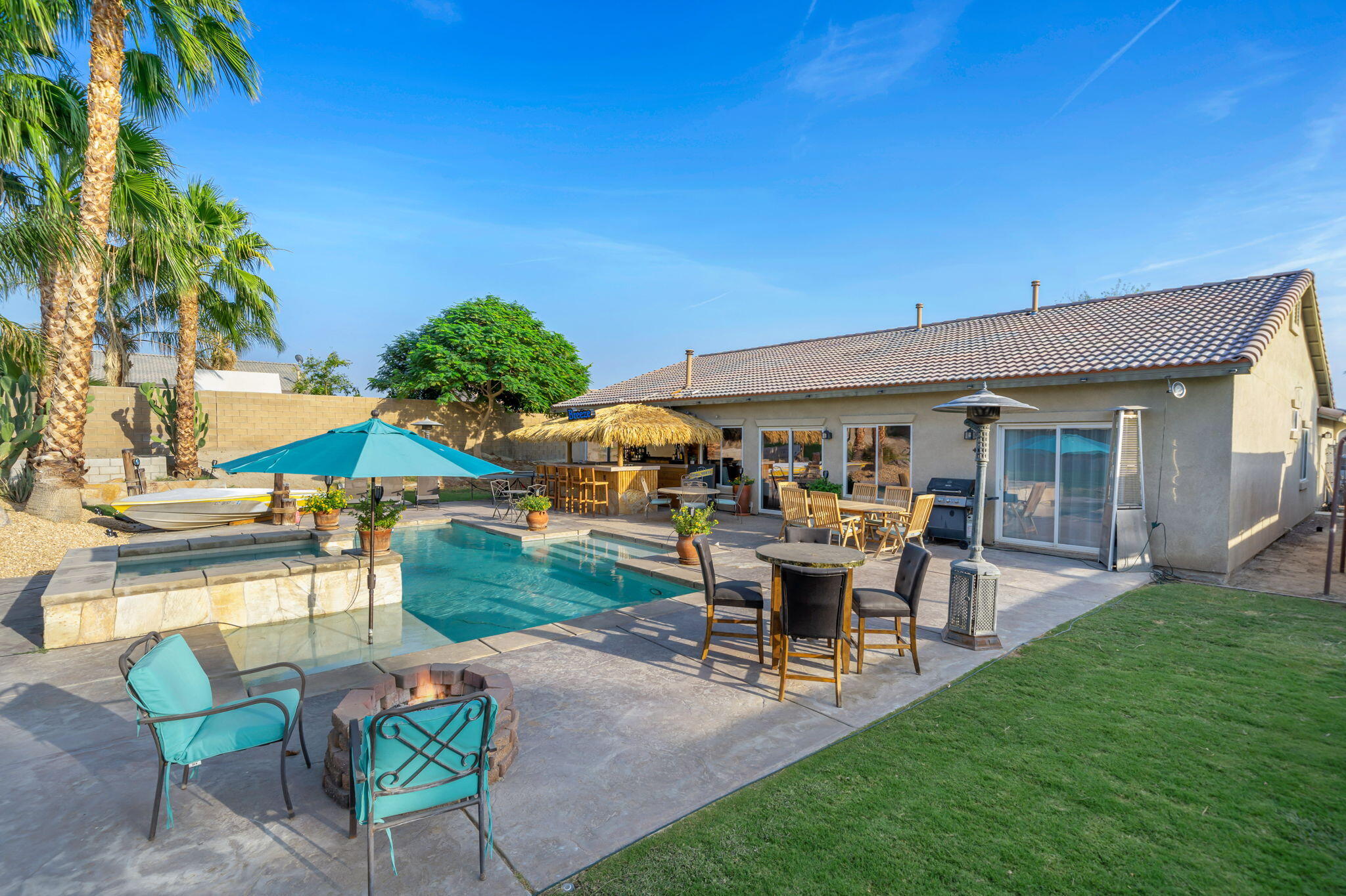 83258 Brighton Crest Drive Indio, CA 92203 - Photo 33 of 69 a view of a house with backyard porch and sitting area