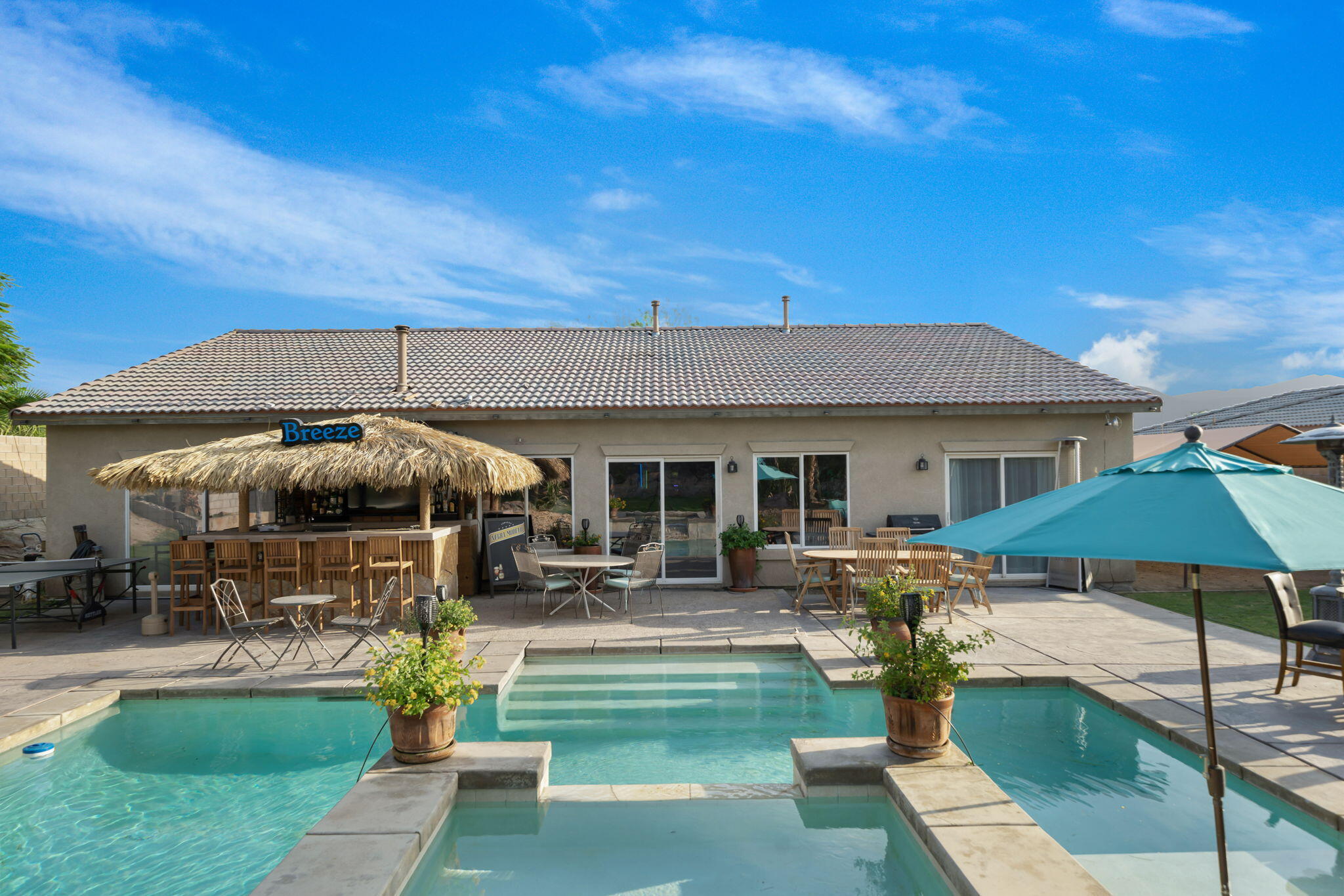 83258 Brighton Crest Drive Indio, CA 92203 - Photo 34 of 69 a view of a house with backyard porch and sitting area