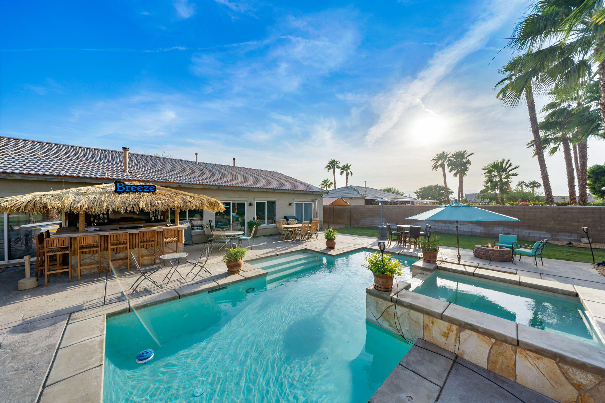 83258 Brighton Crest Drive Indio, CA 92203 - Photo 36 of 69 a view of a swimming pool with outdoor seating