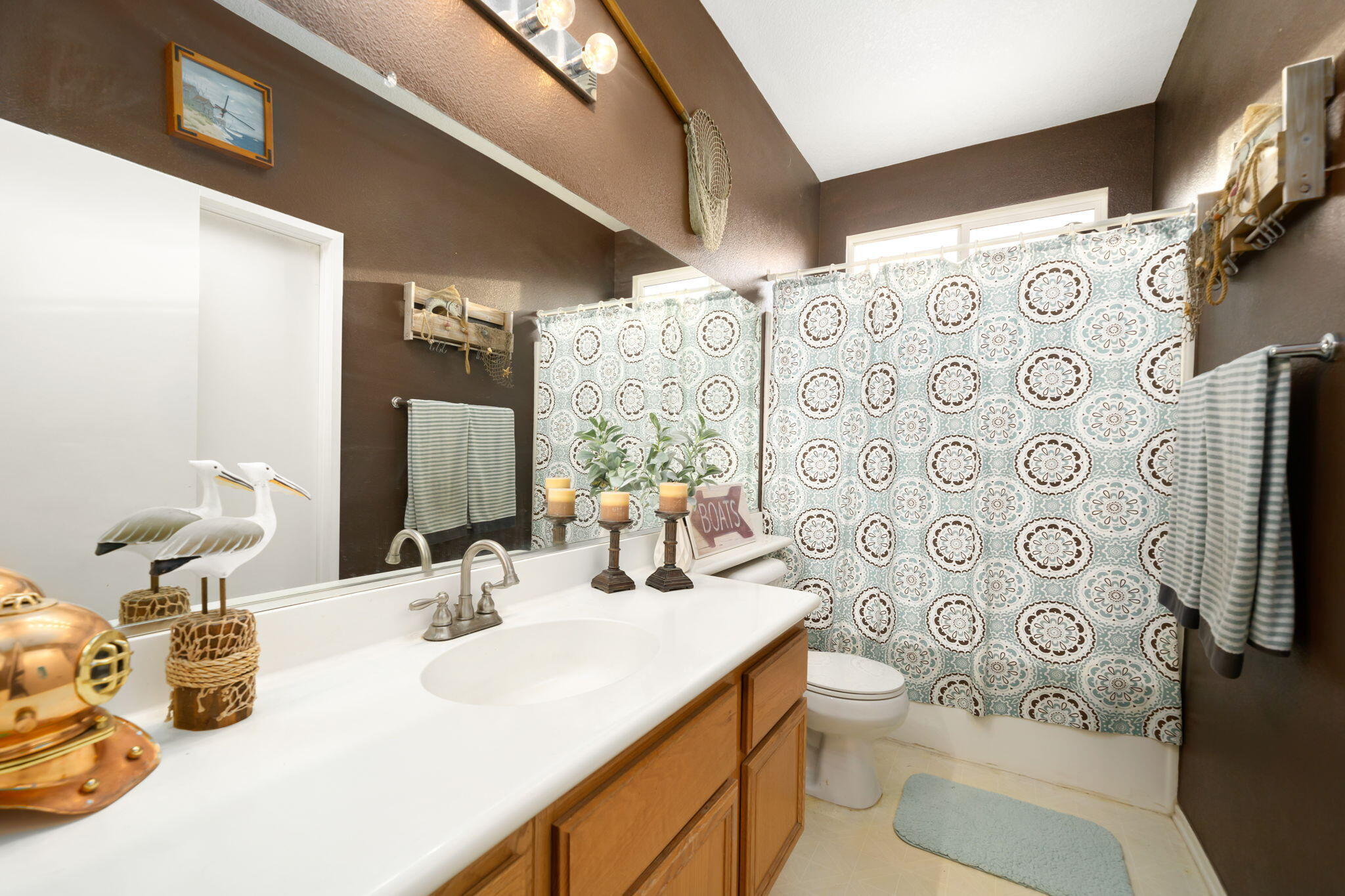 83258 Brighton Crest Drive Indio, CA 92203 - Photo 45 of 69 a bathroom with a sink toilet and shower