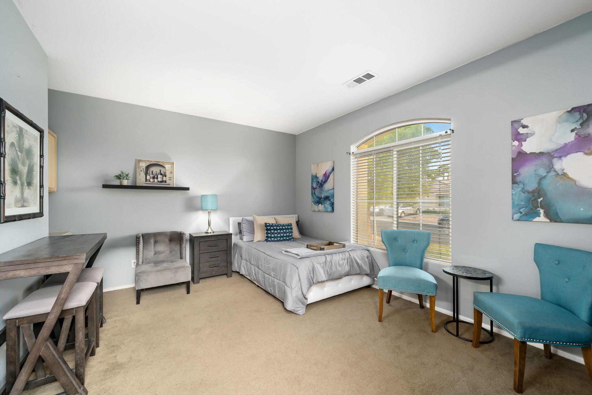83258 Brighton Crest Drive Indio, CA 92203 - Photo 52 of 69 a living room with furniture and a large window