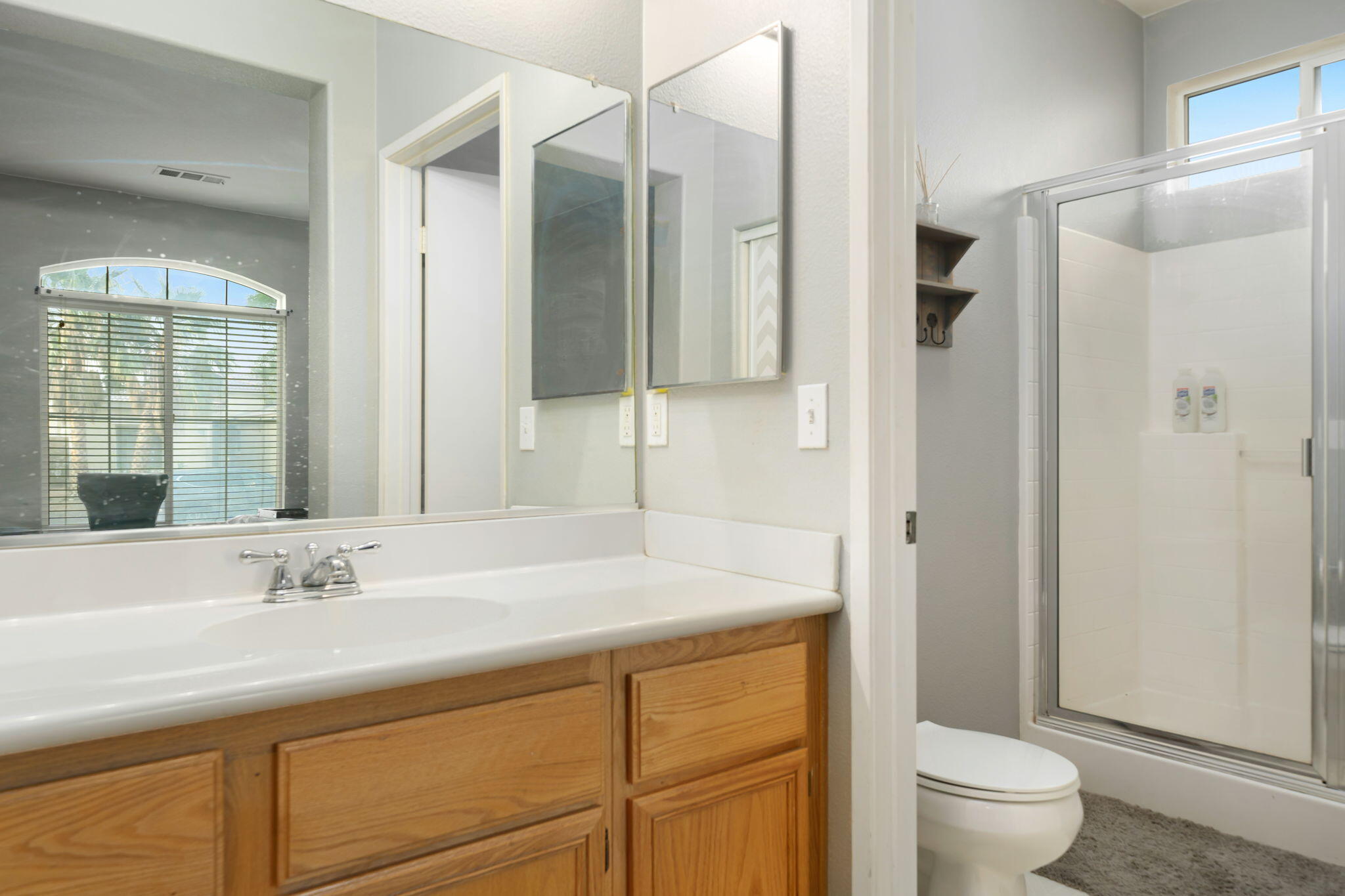83258 Brighton Crest Drive Indio, CA 92203 - Photo 54 of 69 a bathroom with a sink toilet and shower