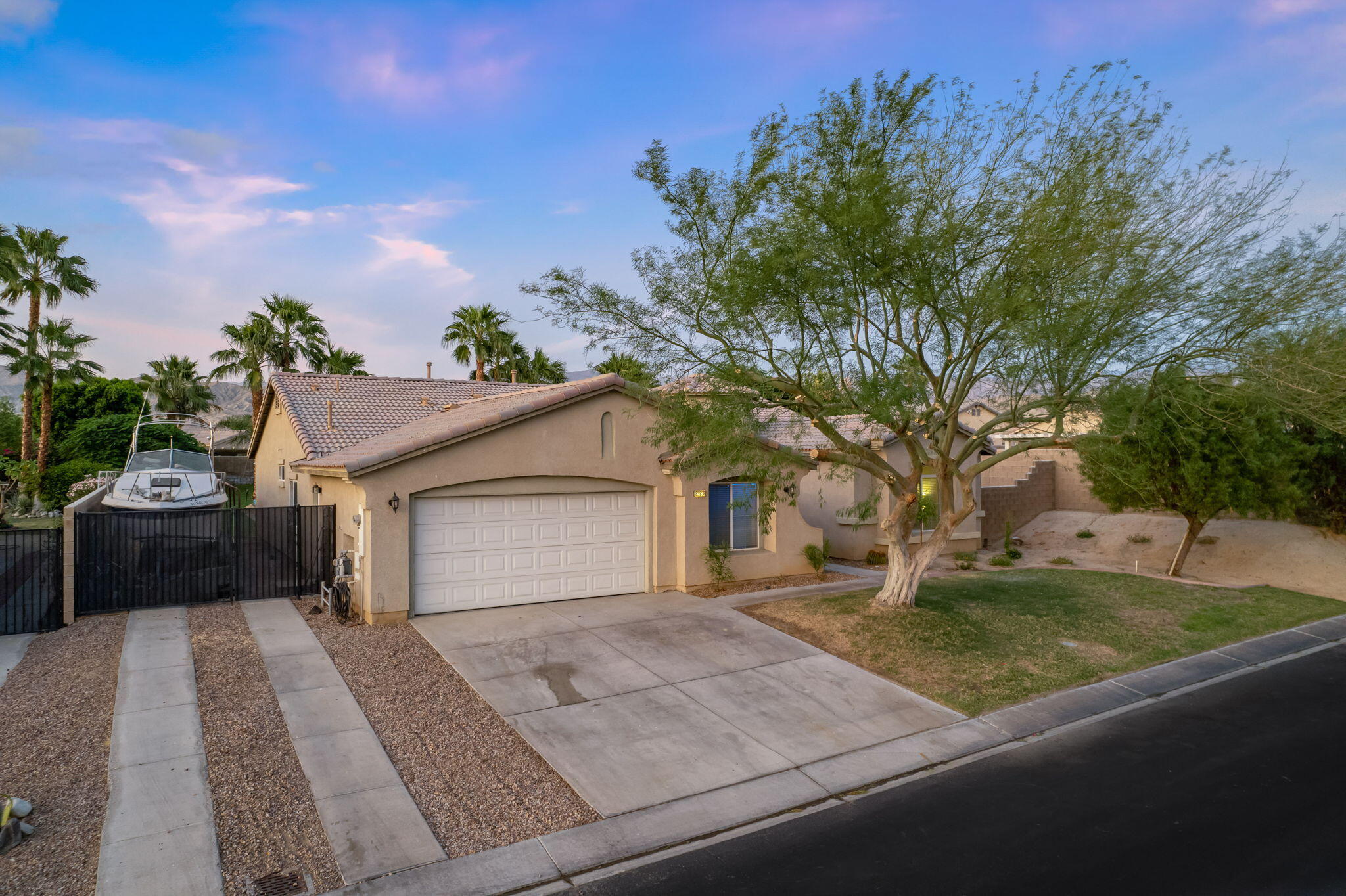 83258 Brighton Crest Drive Indio, CA 92203 - Photo 56 of 69 a view of a house with a yard