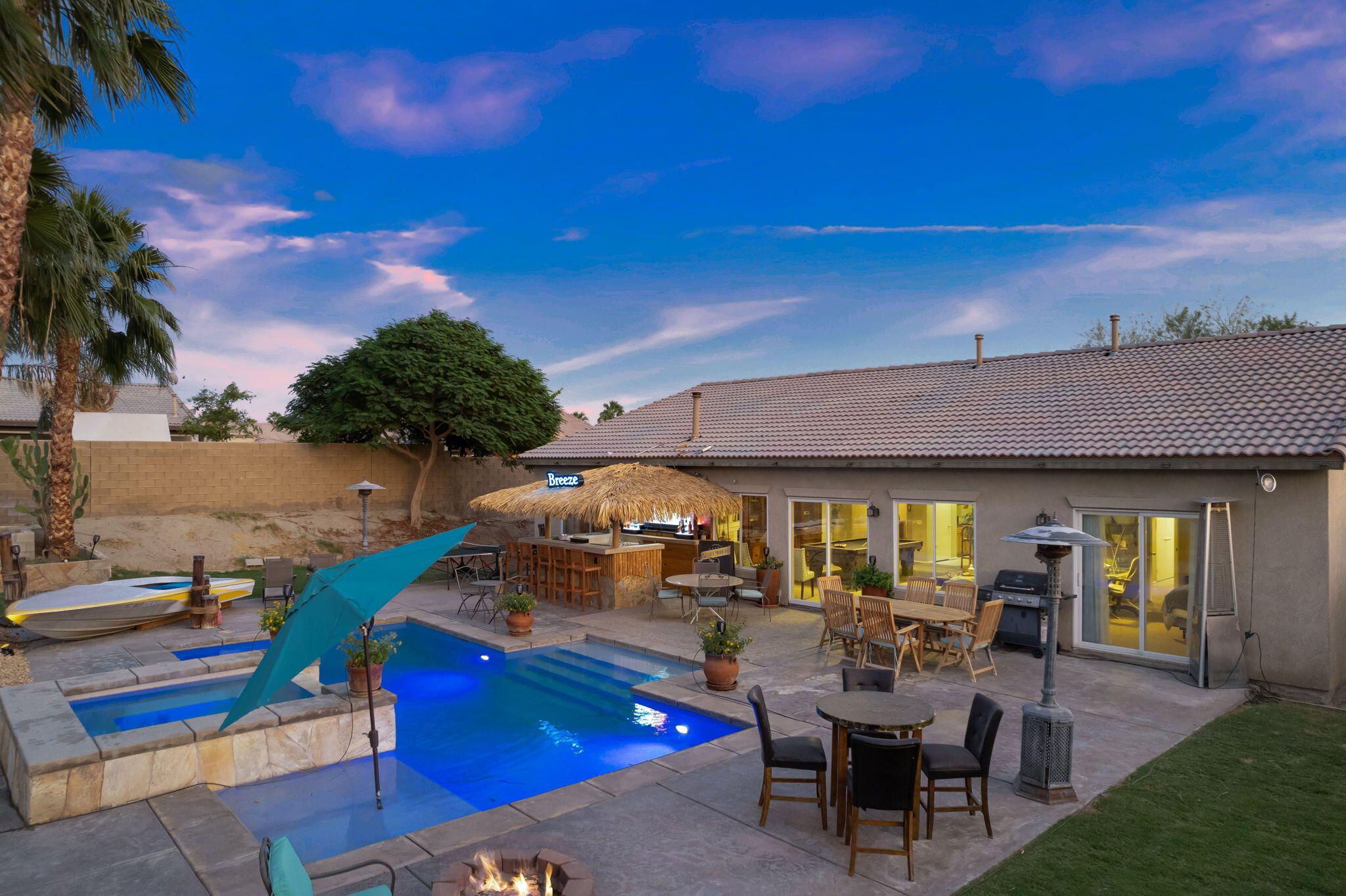 83258 Brighton Crest Drive Indio, CA 92203 - Photo 59 of 69 a view of a patio with table and chairs and potted plants