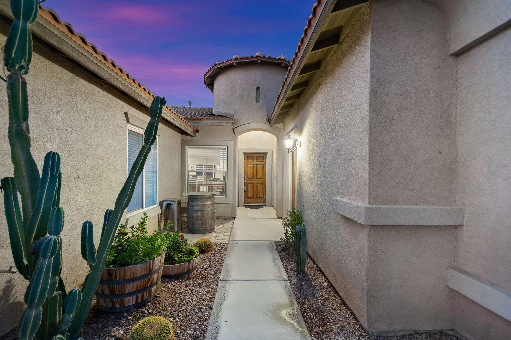 83258 Brighton Crest Drive Indio, CA 92203 - Photo 60 of 69 a front view of a house with outdoor seating and plants