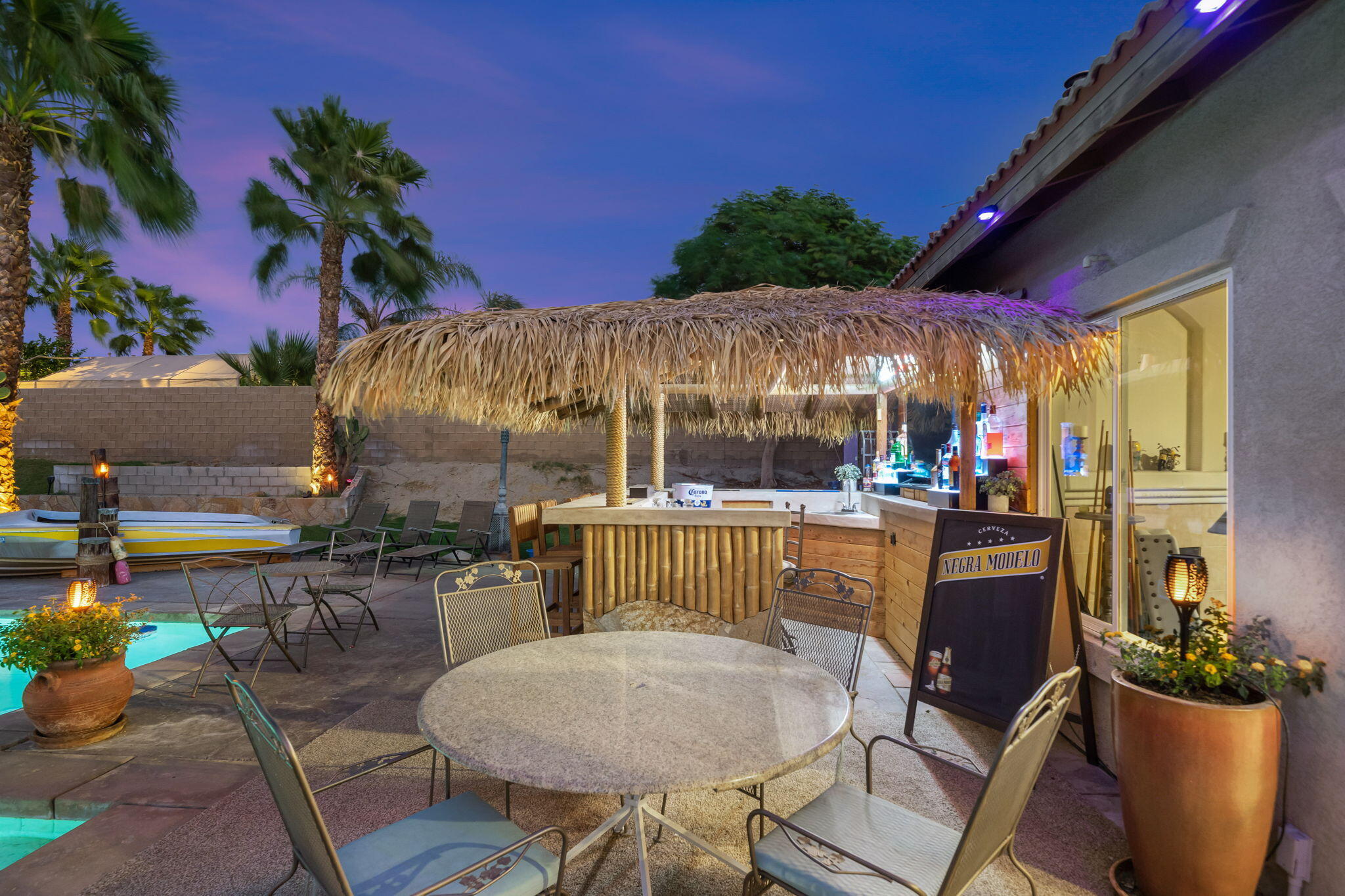 83258 Brighton Crest Drive Indio, CA 92203 - Photo 62 of 69 a view of a patio with table and chairs and potted plants