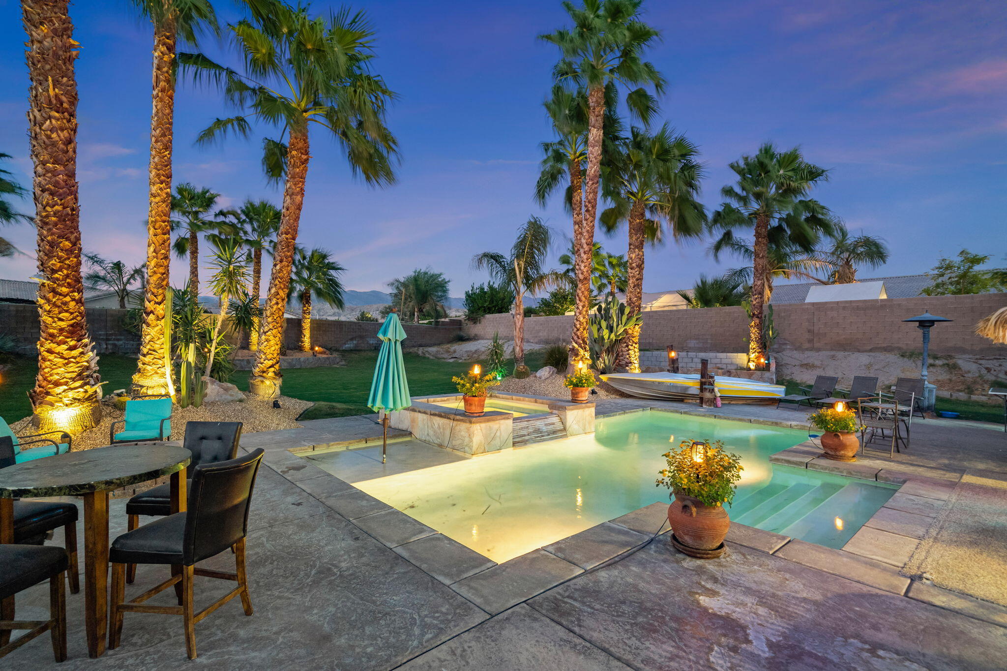 83258 Brighton Crest Drive Indio, CA 92203 - Photo 65 of 69 a view of a backyard with plants and chairs