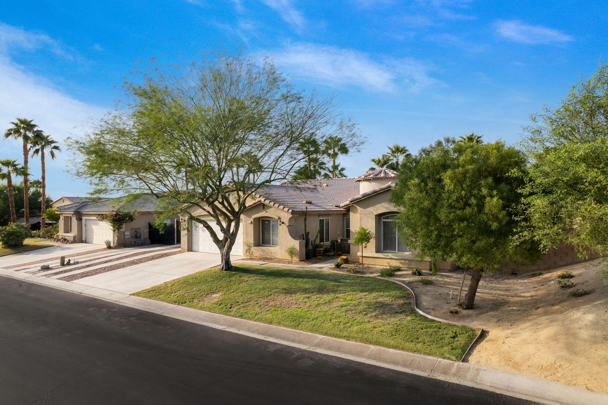 83258 Brighton Crest Drive Indio, CA 92203 - Photo 9 of 69 a front view of a house with garden