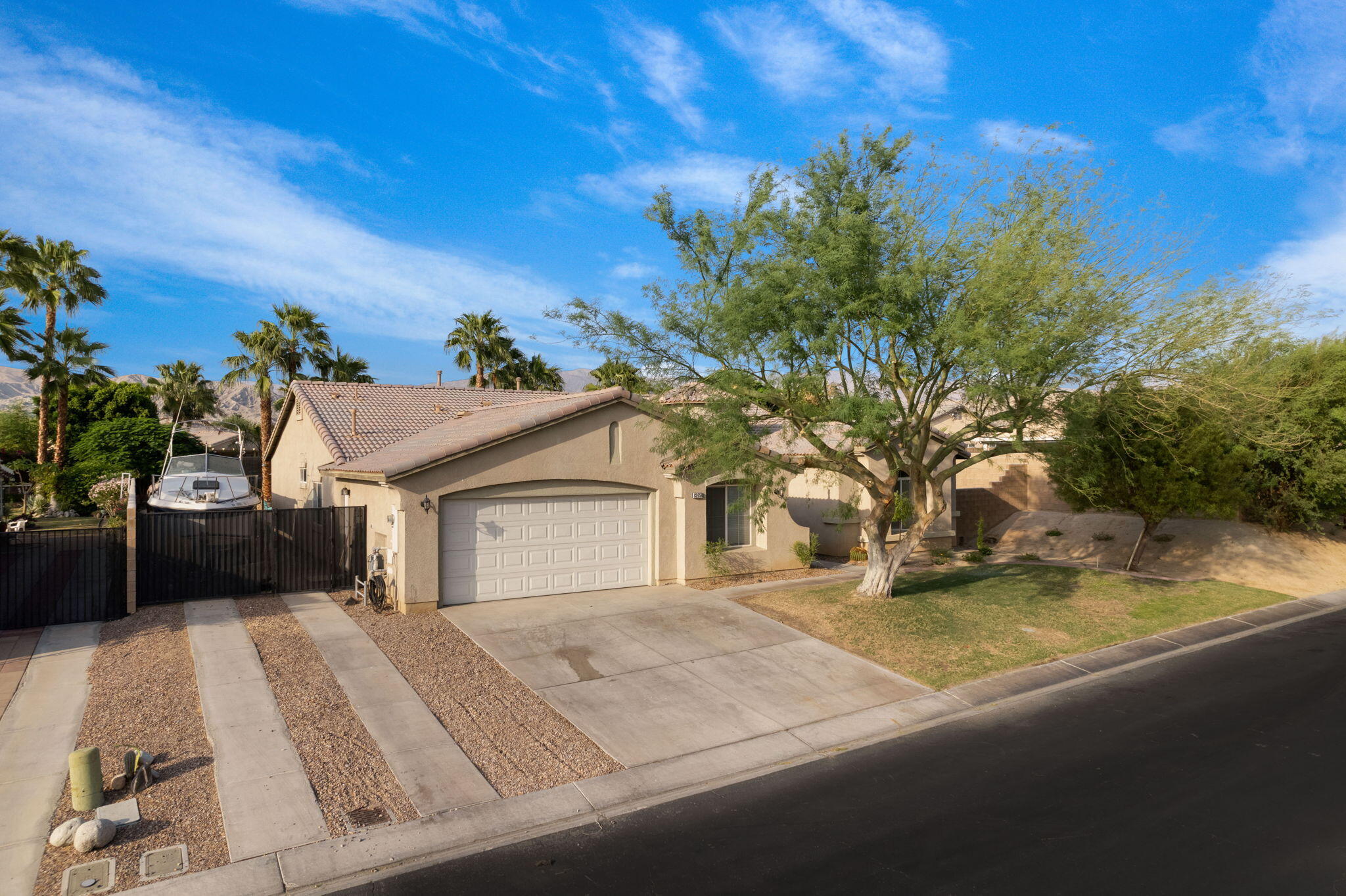 83258 Brighton Crest Drive Indio, CA 92203 - Photo 10 of 69 a view of a house with a yard