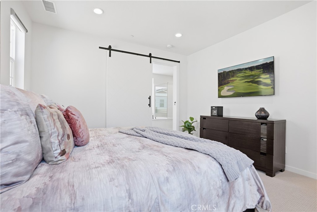 22 Jarano Street Rancho Mission Viejo, CA 92694 - Photo 18 of 75 a bedroom with a bed and a flat screen tv