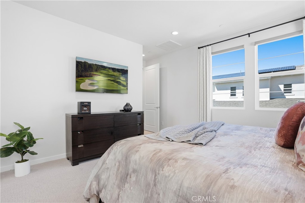 22 Jarano Street Rancho Mission Viejo, CA 92694 - Photo 19 of 75 a bedroom with a bed and a flat screen tv