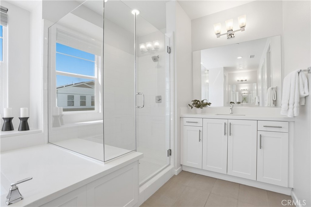 22 Jarano Street Rancho Mission Viejo, CA 92694 - Photo 22 of 75 a bathroom with a shower sink and mirror