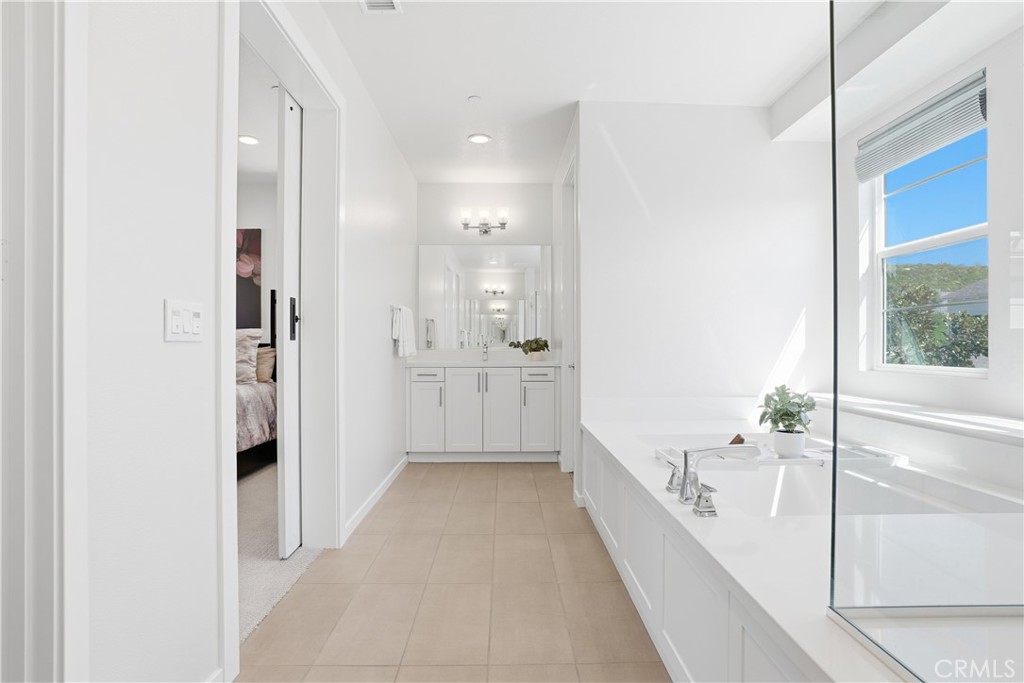 22 Jarano Street Rancho Mission Viejo, CA 92694 - Photo 23 of 75 a bathroom with a bathtub and a shower