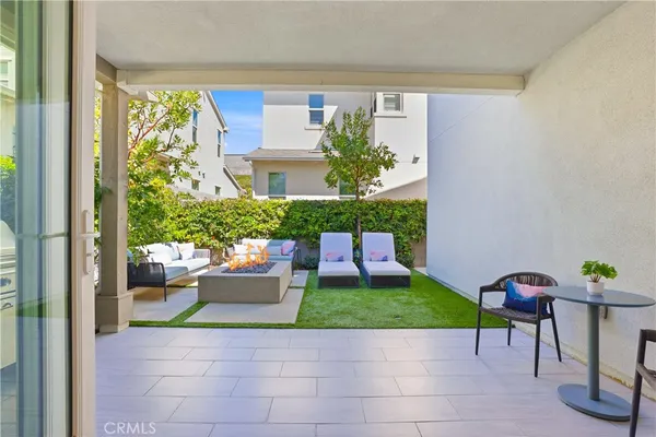 a front view of a house with a garden and plants