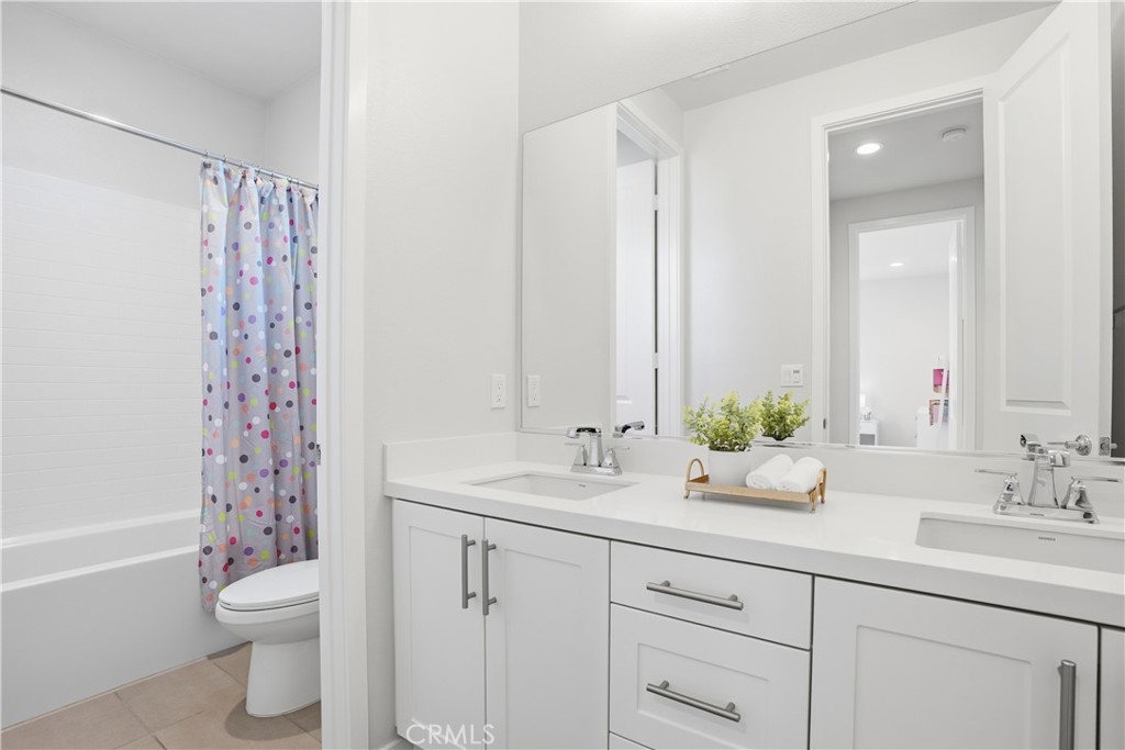 22 Jarano Street Rancho Mission Viejo, CA 92694 - Photo 34 of 75 a bathroom with a double vanity sink toilet and shower