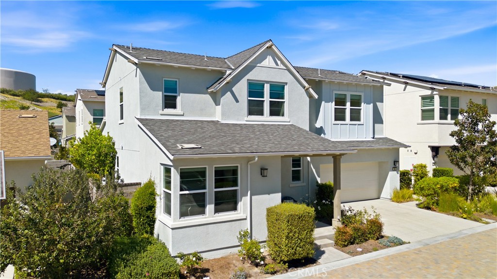 22 Jarano Street Rancho Mission Viejo, CA 92694 - Photo 43 of 75 a front view of a house with a yard