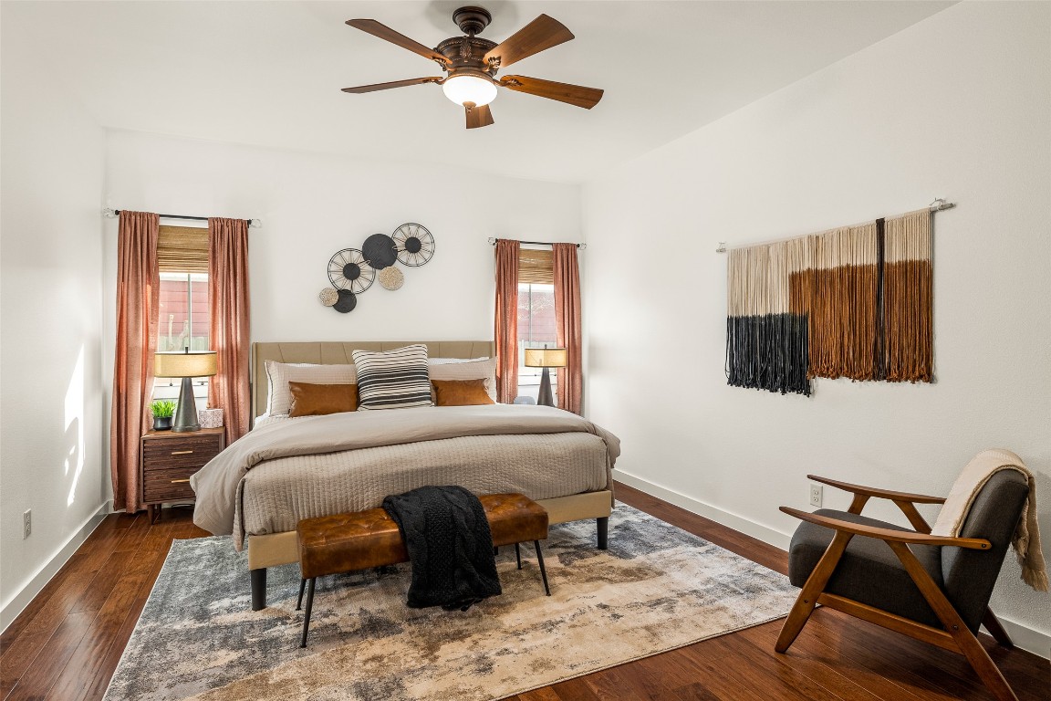 435 Hays Street Dripping Springs, TX 78620 - Photo 13 of 36 a bedroom with a bed and a chair