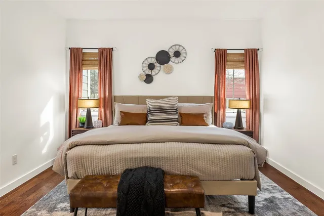 a bedroom with a bed and window