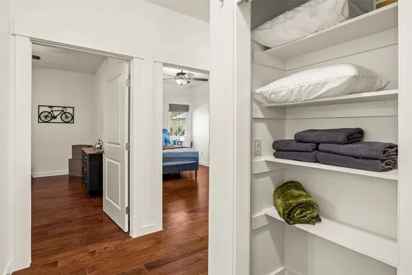 a kitchen with a refrigerator and a stove top oven