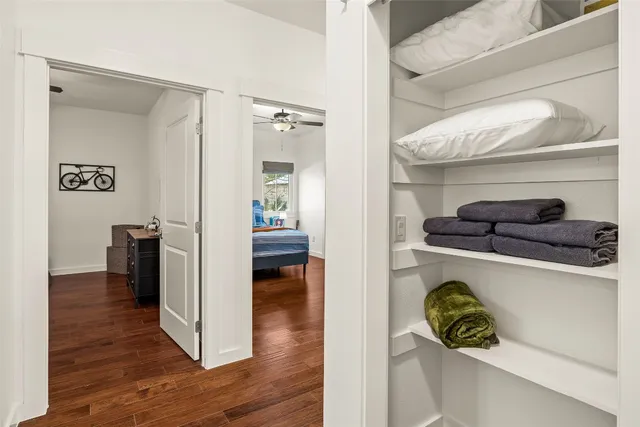 a kitchen with a refrigerator and a stove top oven