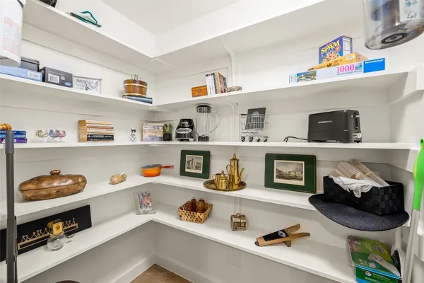 a kitchen with stainless steel appliances granite countertop a stove top oven and cabinets