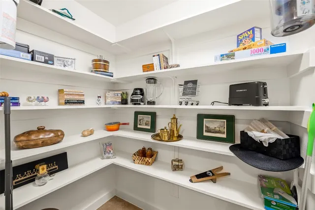 a kitchen with stainless steel appliances granite countertop a stove top oven and cabinets