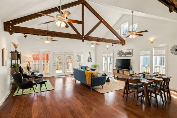 a view of a livingroom with furniture and a flat screen tv