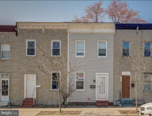 a front view of a house with stairs
