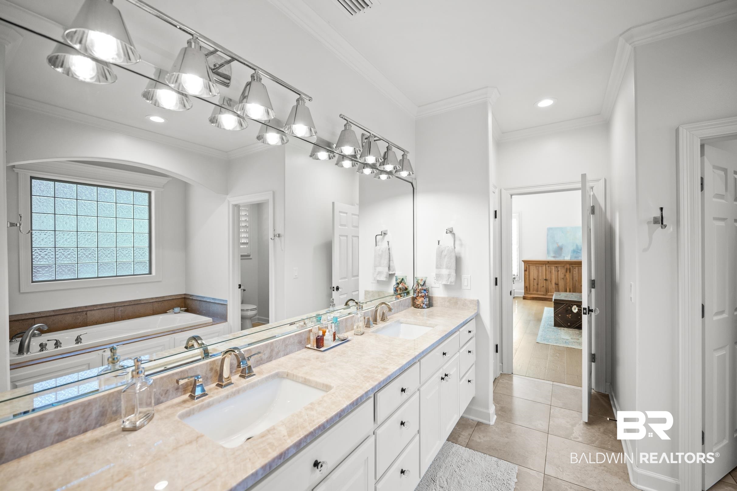 115 Sandy Ford Road Fairhope, AL 36532 - Photo 30 of 47 Full bathroom with tile patterned flooring, a garden tub, ornamental molding, double vanity, and recessed lighting