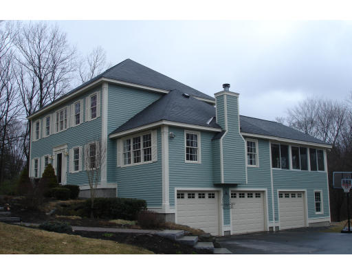 4 Andrea Terrace Shirley, MA 01464 - Photo 1 of 19 a front view of a house with a yard