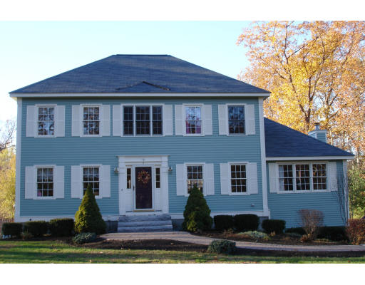 4 Andrea Terrace Shirley, MA 01464 - Photo 2 of 19 a front view of a house with a garden
